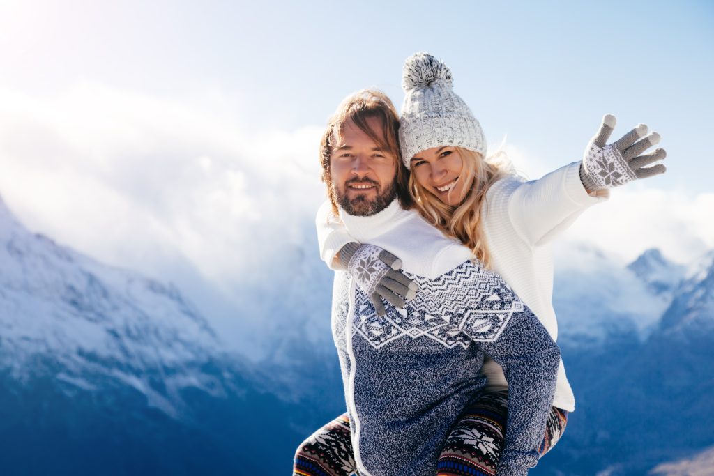 couple on mountain in winter