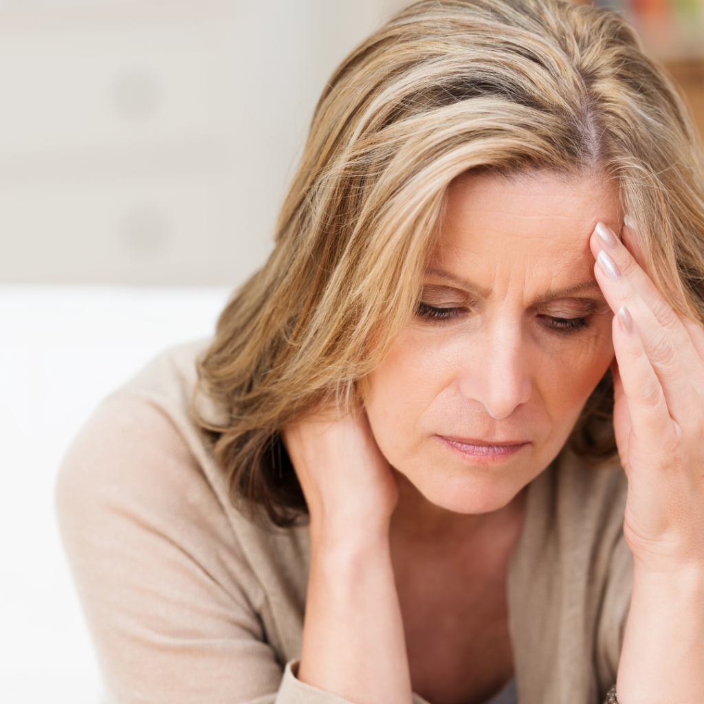 woman holding head, stressed