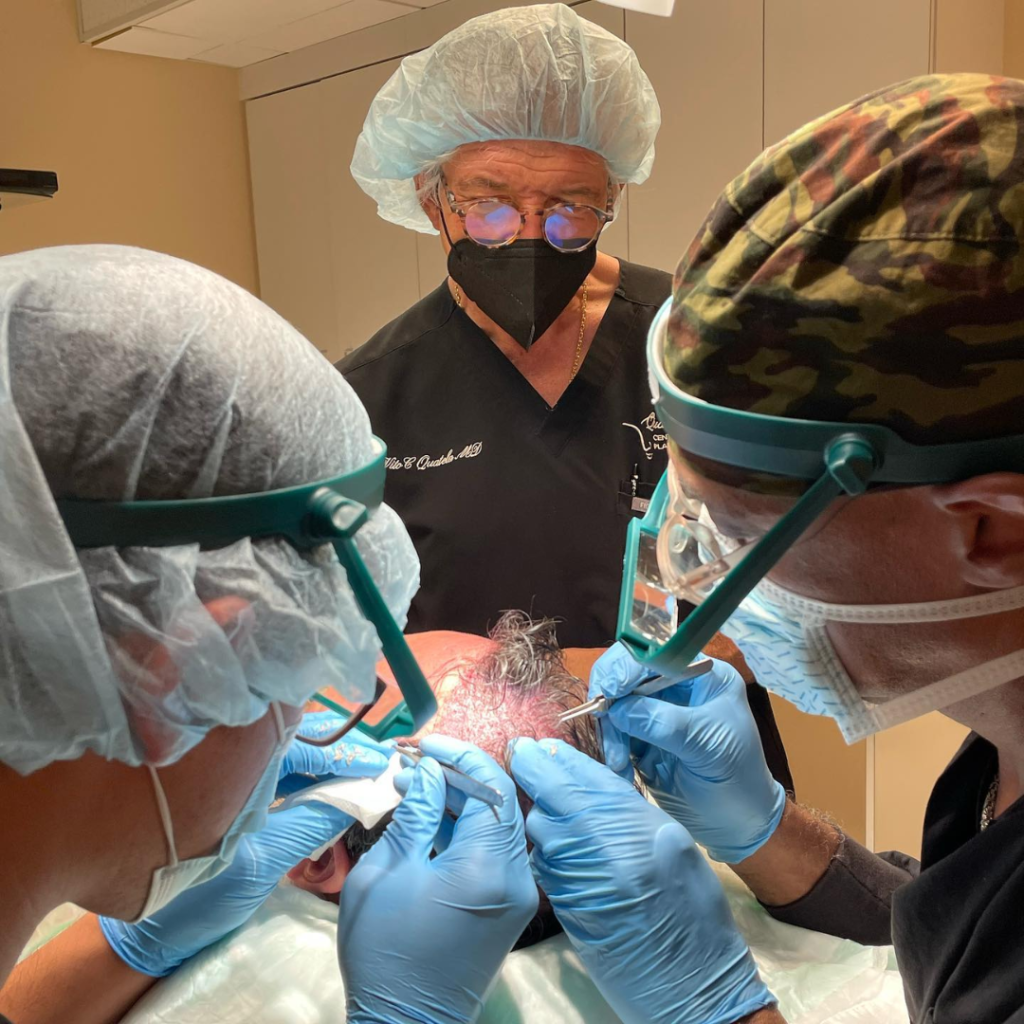 Dr. Quatela and hair team transplanting hair grafts into patient scalp